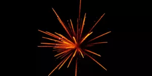 red and orange fireworks in black background